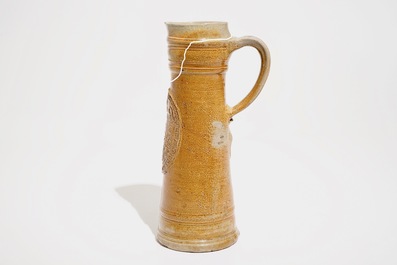 A large Raeren stoneware schnelle type mug with the arms of Frederick IV, dated 1604